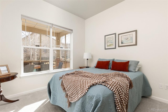 bedroom with carpet and baseboards