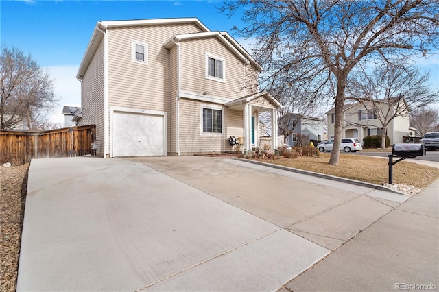 front of property with a garage