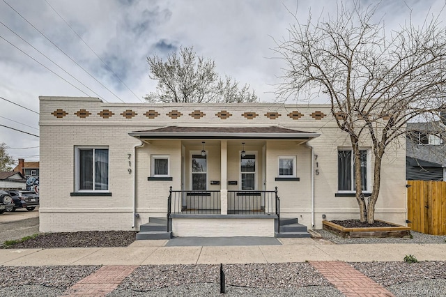 715 W 7th Ave, Denver, CO 80204 - multi unit property featuring brick siding and covered porch