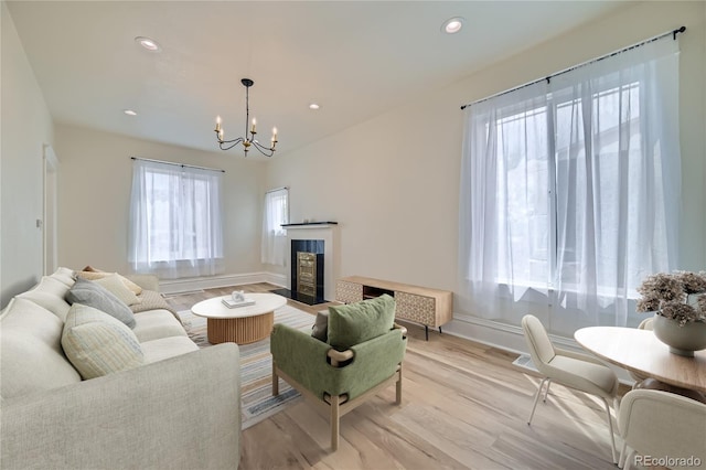 715 W 7th Ave, Denver, CO 80204 - living area with a chandelier, light wood-style flooring, recessed lighting, and a tile fireplace