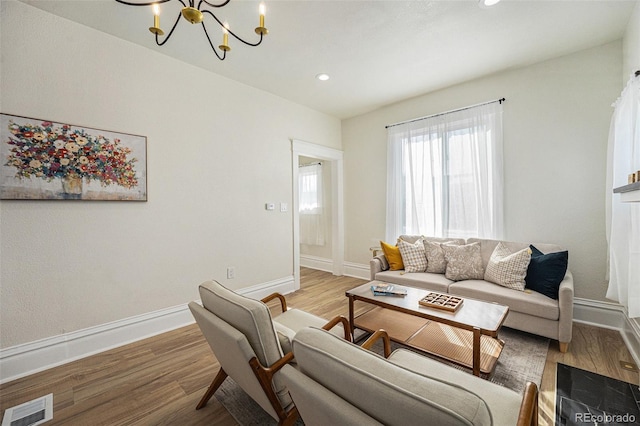 715 W 7th Ave, Denver, CO 80204 - living room with a chandelier, light wood-style floors, and recessed lighting