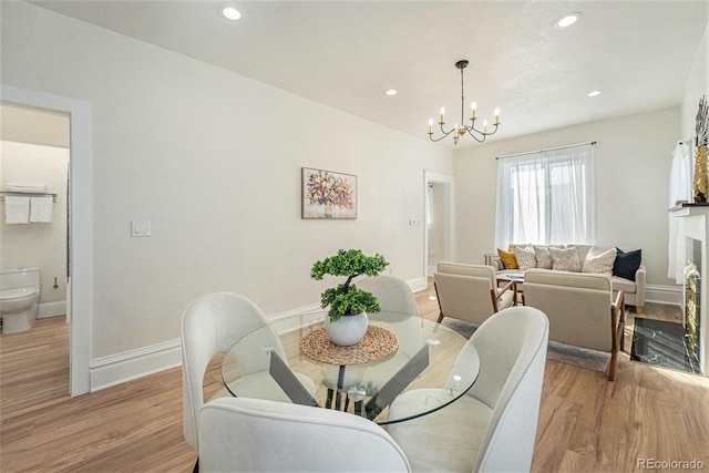 715 W 7th Ave, Denver, CO 80204 - dining room with light wood-type flooring, a chandelier, and recessed lighting
