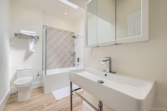 715 W 7th Ave, Denver, CO 80204 - bathroom featuring wood finished floors and bathing tub / shower combination
