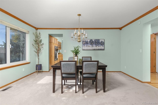 carpeted dining room with ornamental molding and a notable chandelier