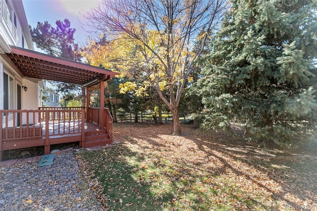 yard at dusk with a wooden deck