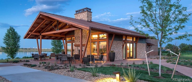 2415 Bluestem Willow Dr, Loveland, CO 80538 - view of patio featuring a water view