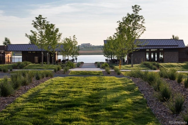 2415 Bluestem Willow Dr, Loveland, CO 80538 - view of community with a water view and a lawn