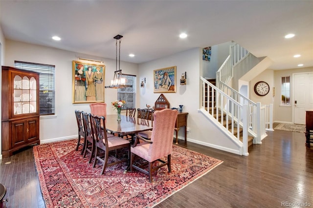 2415 Bluestem Willow Dr, Loveland, CO 80538 - dining area featuring baseboards, stairs, wood finished floors, recessed lighting, and a chandelier