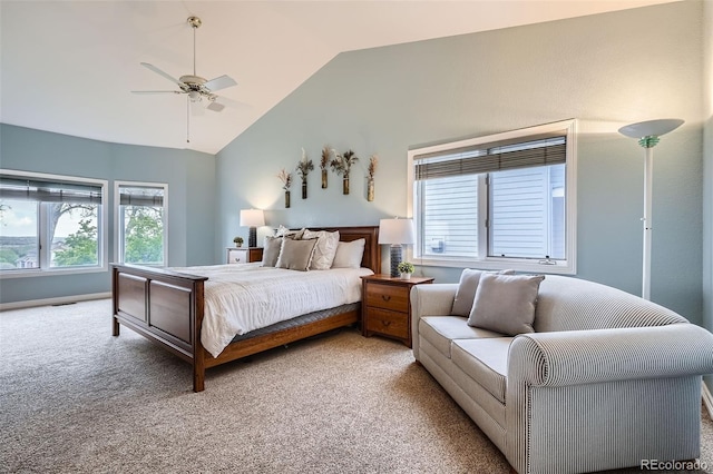 bedroom featuring a ceiling fan, light carpet, and lofted ceiling