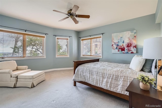 bedroom with baseboards, ceiling fan, and carpet