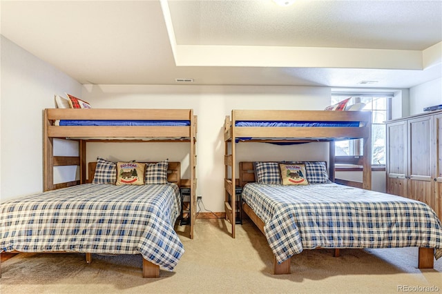 bedroom featuring carpet, visible vents, and baseboards