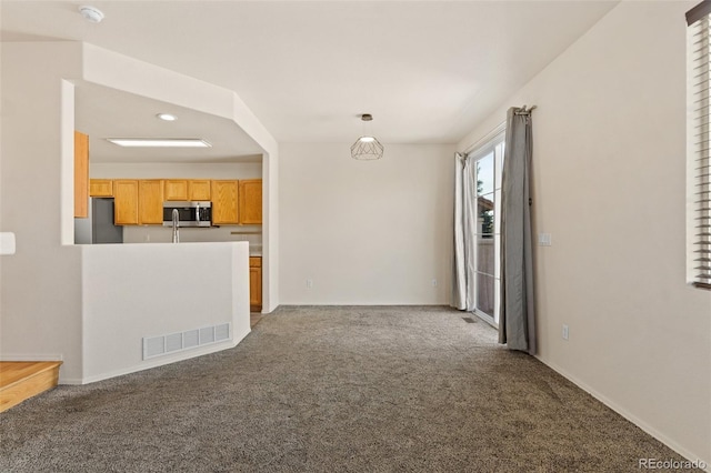 7046 Sand Crest Vw, Colorado Springs, CO 80923 - unfurnished living room with carpet floors, baseboards, and recessed lighting