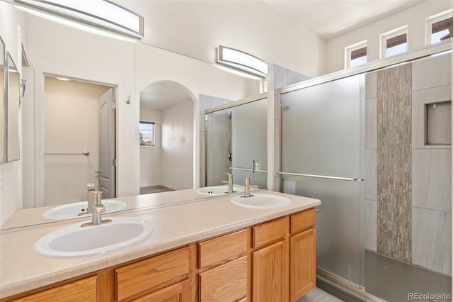 7046 Sand Crest Vw, Colorado Springs, CO 80923 - full bathroom with plenty of natural light, a stall shower, and double vanity