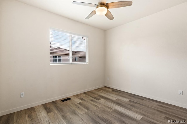 7046 Sand Crest Vw, Colorado Springs, CO 80923 - unfurnished room featuring wood finished floors, ceiling fan, and baseboards