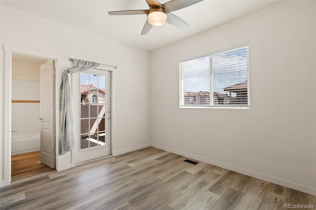 7046 Sand Crest Vw, Colorado Springs, CO 80923 - unfurnished room featuring wood finished floors, a ceiling fan, and baseboards