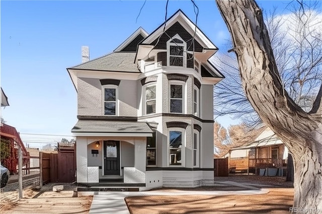 1021 Lake Ave, Pueblo, CO 81004 - victorian house with stucco siding and a chimney