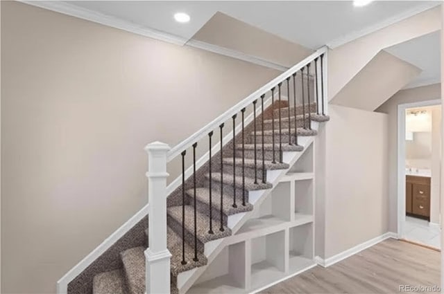 1021 Lake Ave, Pueblo, CO 81004 - staircase featuring wood finished floors, recessed lighting, ornamental molding, and baseboards