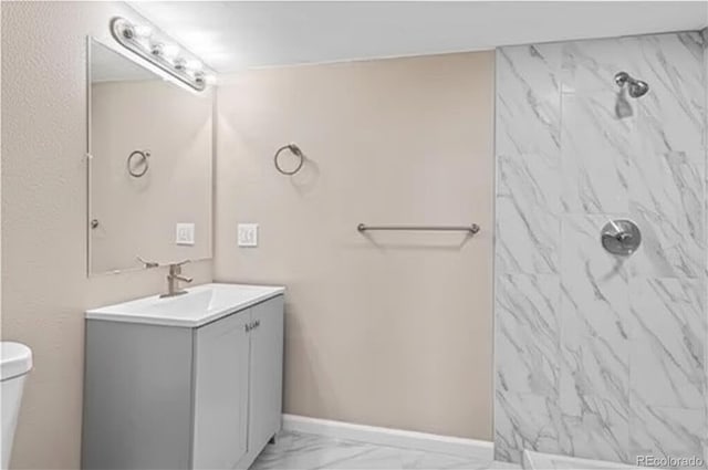 1021 Lake Ave, Pueblo, CO 81004 - bathroom with toilet, vanity, a shower, and marble finish flooring