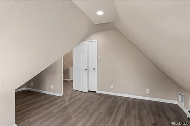 1021 Lake Ave, Pueblo, CO 81004 - additional living space with wood finished floors, vaulted ceiling, baseboards, and recessed lighting