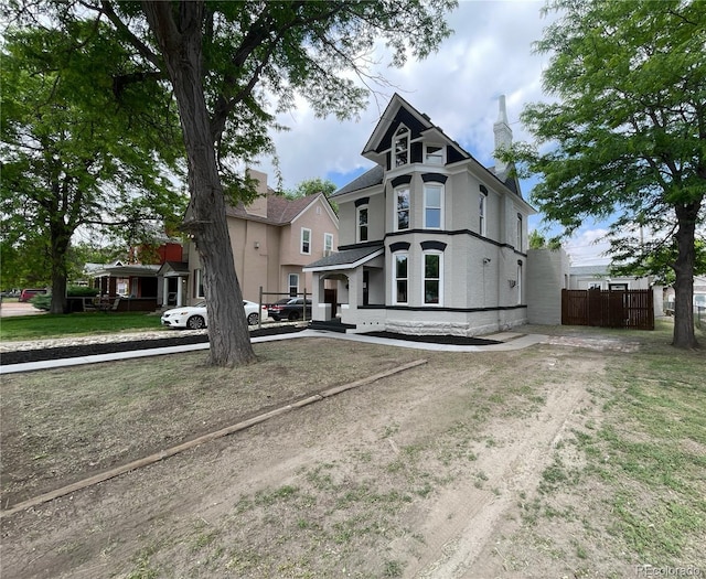 1021 Lake Ave, Pueblo, CO 81004 - victorian home with a chimney and uncovered parking