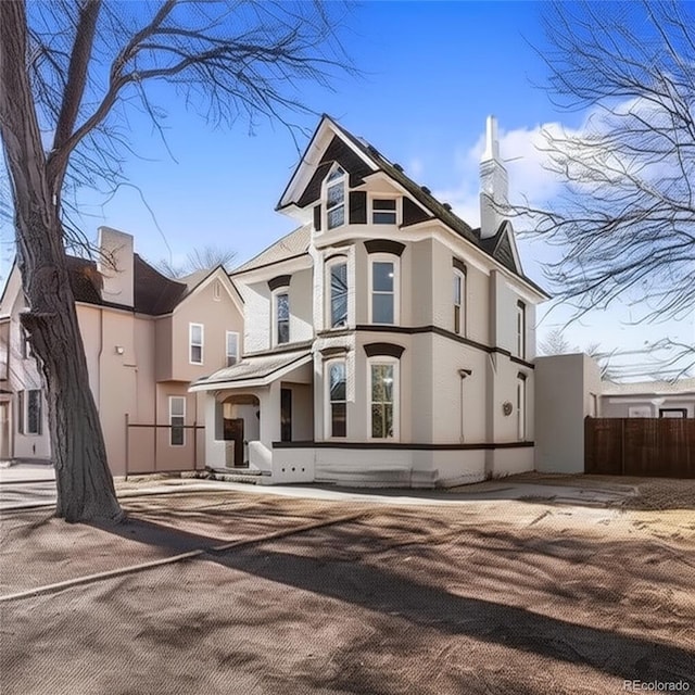 1021 Lake Ave, Pueblo, CO 81004 - victorian house featuring stucco siding and a chimney