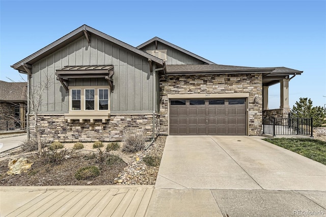 3477 New Haven Cir, Castle Rock, CO 80109 - view of front facade featuring stone siding, a garage, board and batten siding, driveway, and roof with shingles