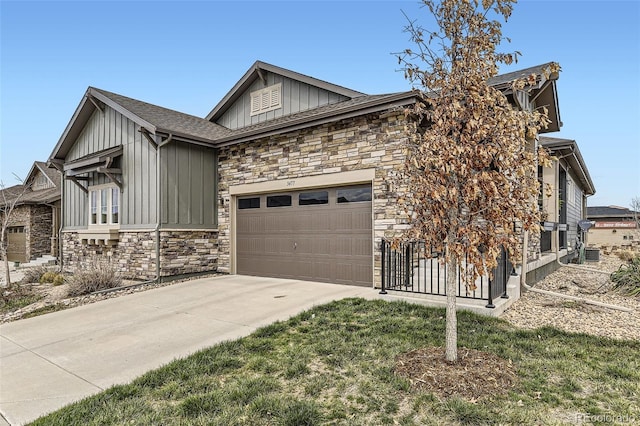 3477 New Haven Cir, Castle Rock, CO 80109 - view of property exterior with board and batten siding, stone siding, an attached garage, and driveway
