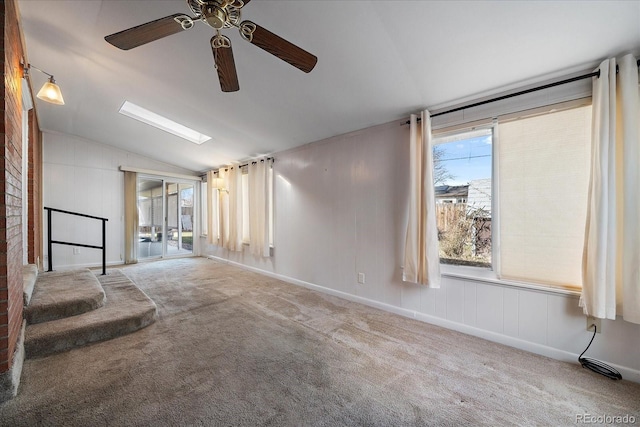 interior space with ceiling fan and vaulted ceiling