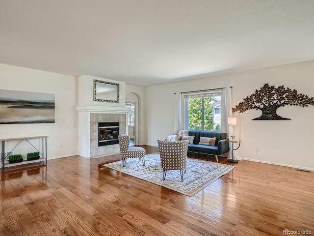 7746 S Valdai Ct, Aurora, CO 80016 - living room with wood finished floors and a tile fireplace