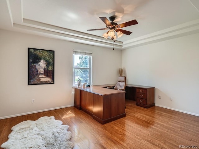 7746 S Valdai Ct, Aurora, CO 80016 - office area featuring a tray ceiling, wood-type flooring, and ceiling fan