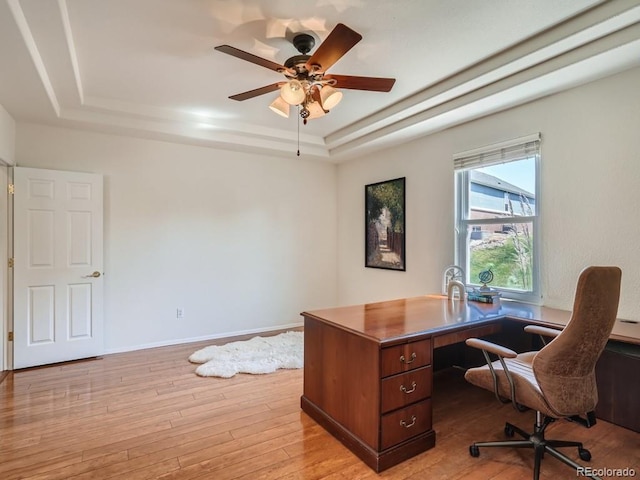 7746 S Valdai Ct, Aurora, CO 80016 - office featuring a tray ceiling, light wood finished floors, and ceiling fan