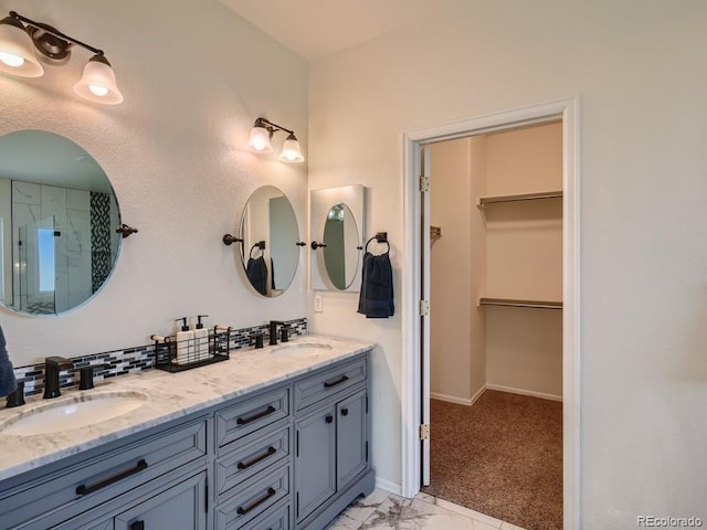 7746 S Valdai Ct, Aurora, CO 80016 - full bathroom featuring double vanity, a spacious closet, a shower, and marble look tile flooring