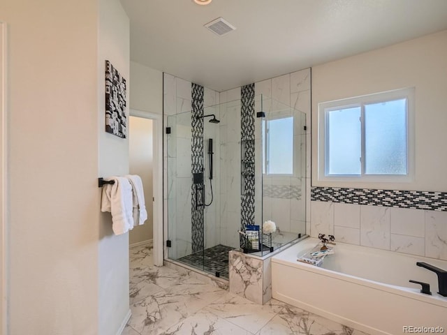 7746 S Valdai Ct, Aurora, CO 80016 - full bathroom featuring a garden tub, a stall shower, and marble finish floors