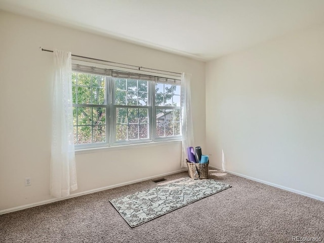 7746 S Valdai Ct, Aurora, CO 80016 - spare room with carpet