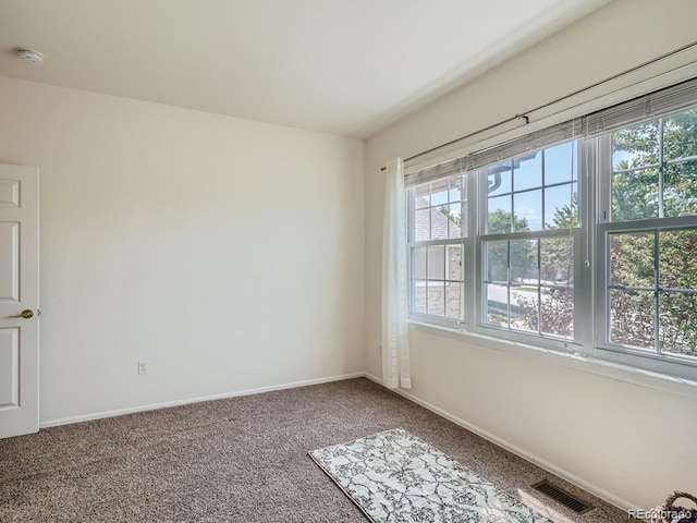 7746 S Valdai Ct, Aurora, CO 80016 - carpeted spare room featuring baseboards and a smoke detector