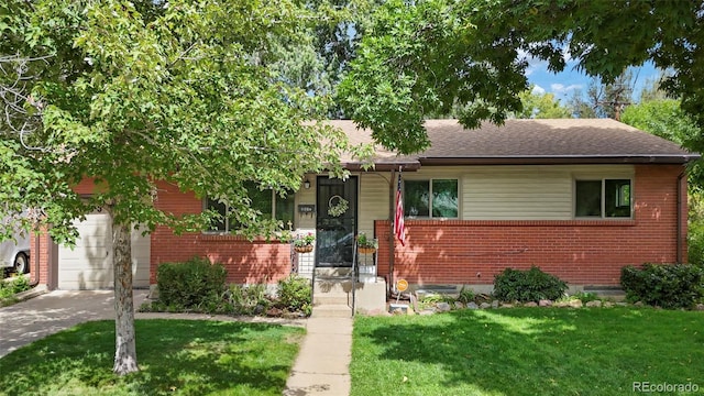 view of front of home with concrete driveway, brick siding, a front lawn, and roof with shingles