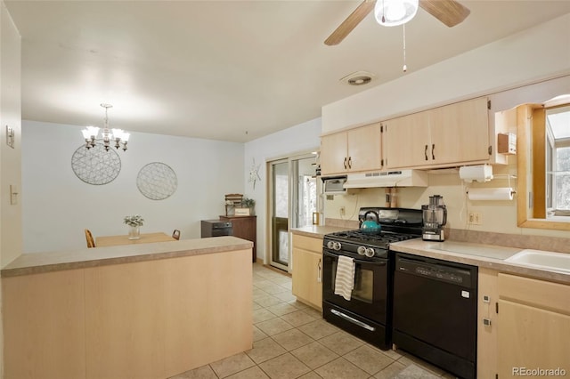 kitchen featuring black appliances, a healthy amount of sunlight, light countertops, and under cabinet range hood