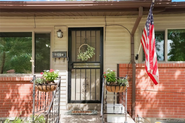 doorway to property featuring a porch