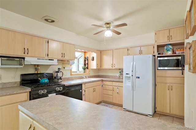 kitchen with visible vents, under cabinet range hood, black appliances, light brown cabinets, and a sink