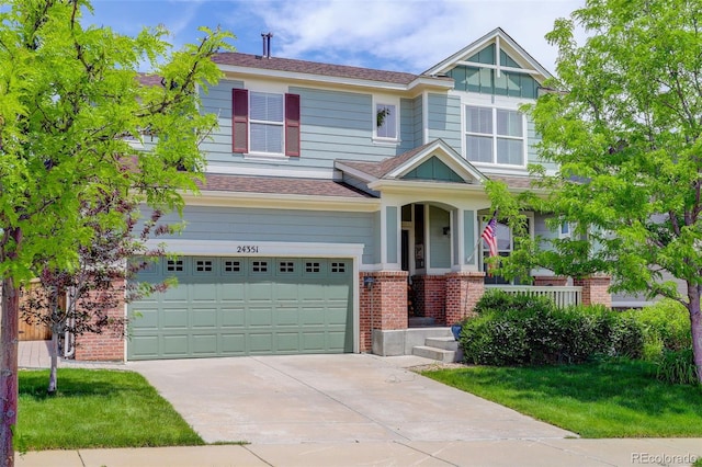 24351 E Alamo Dr, Aurora, CO 80016 - craftsman-style house with an attached garage, concrete driveway, brick siding, a porch, and a front lawn