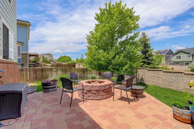 24351 E Alamo Dr, Aurora, CO 80016 - view of patio with an outdoor fire pit and a residential view
