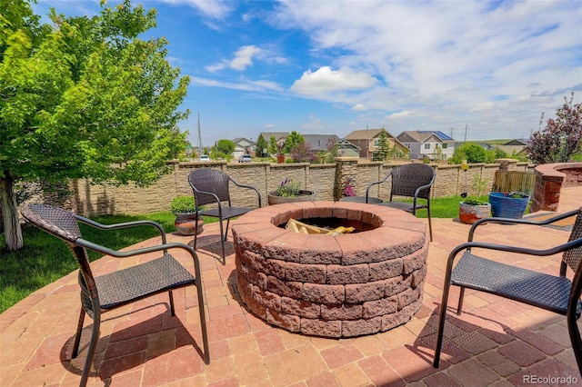 24351 E Alamo Dr, Aurora, CO 80016 - view of patio featuring an outdoor fire pit and a residential view