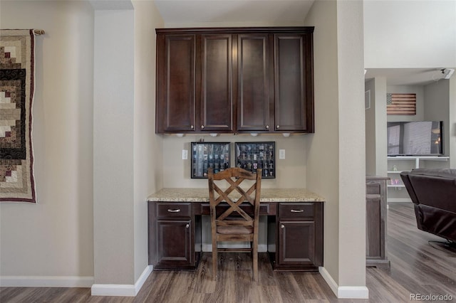 24351 E Alamo Dr, Aurora, CO 80016 - office with dark wood-style flooring, built in study area, and baseboards