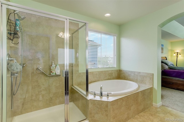 24351 E Alamo Dr, Aurora, CO 80016 - bathroom featuring ensuite bath, a garden tub, tile patterned flooring, and a stall shower