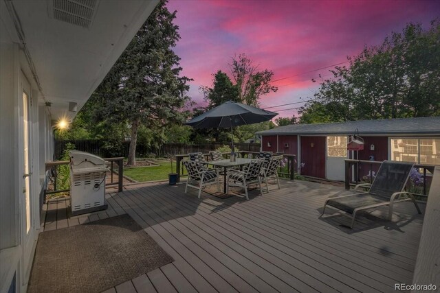 1648 S Locust St, Denver, CO 80224 - wooden deck featuring a fenced backyard, grilling area, and outdoor dining space