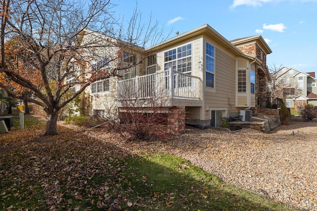 back of property featuring central AC unit