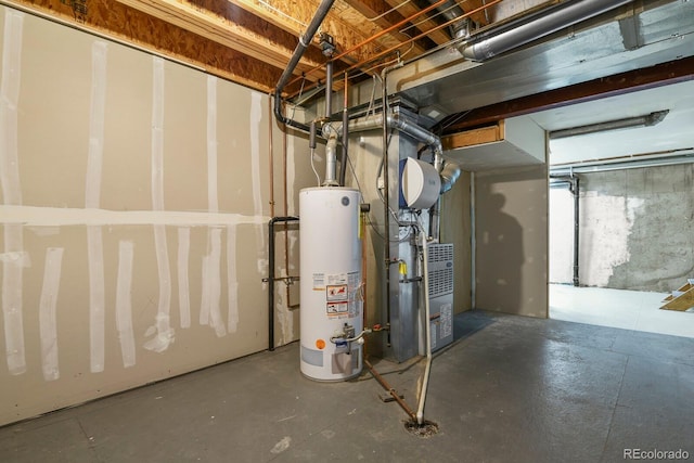 basement with water heater and heating unit