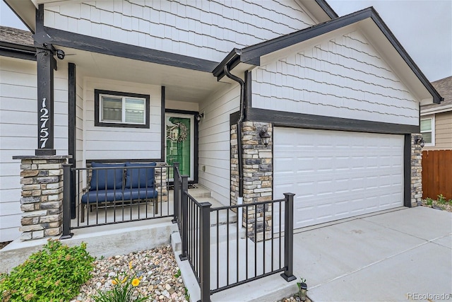 doorway to property with a garage