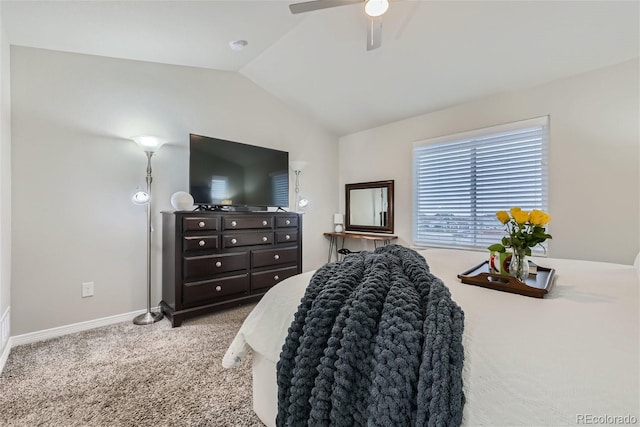 carpeted bedroom featuring lofted ceiling and ceiling fan