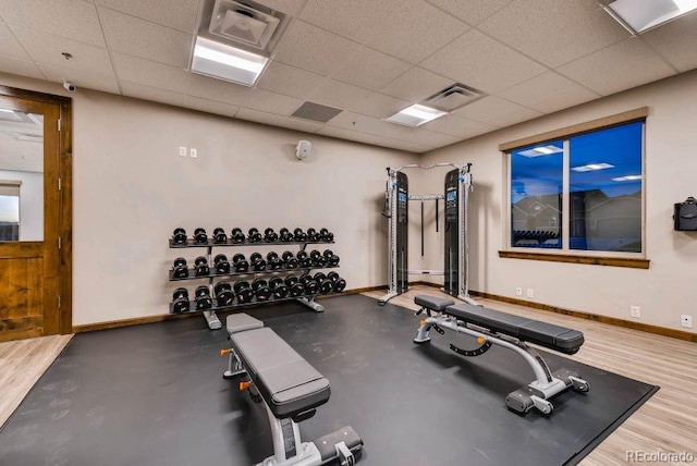 exercise room featuring a drop ceiling